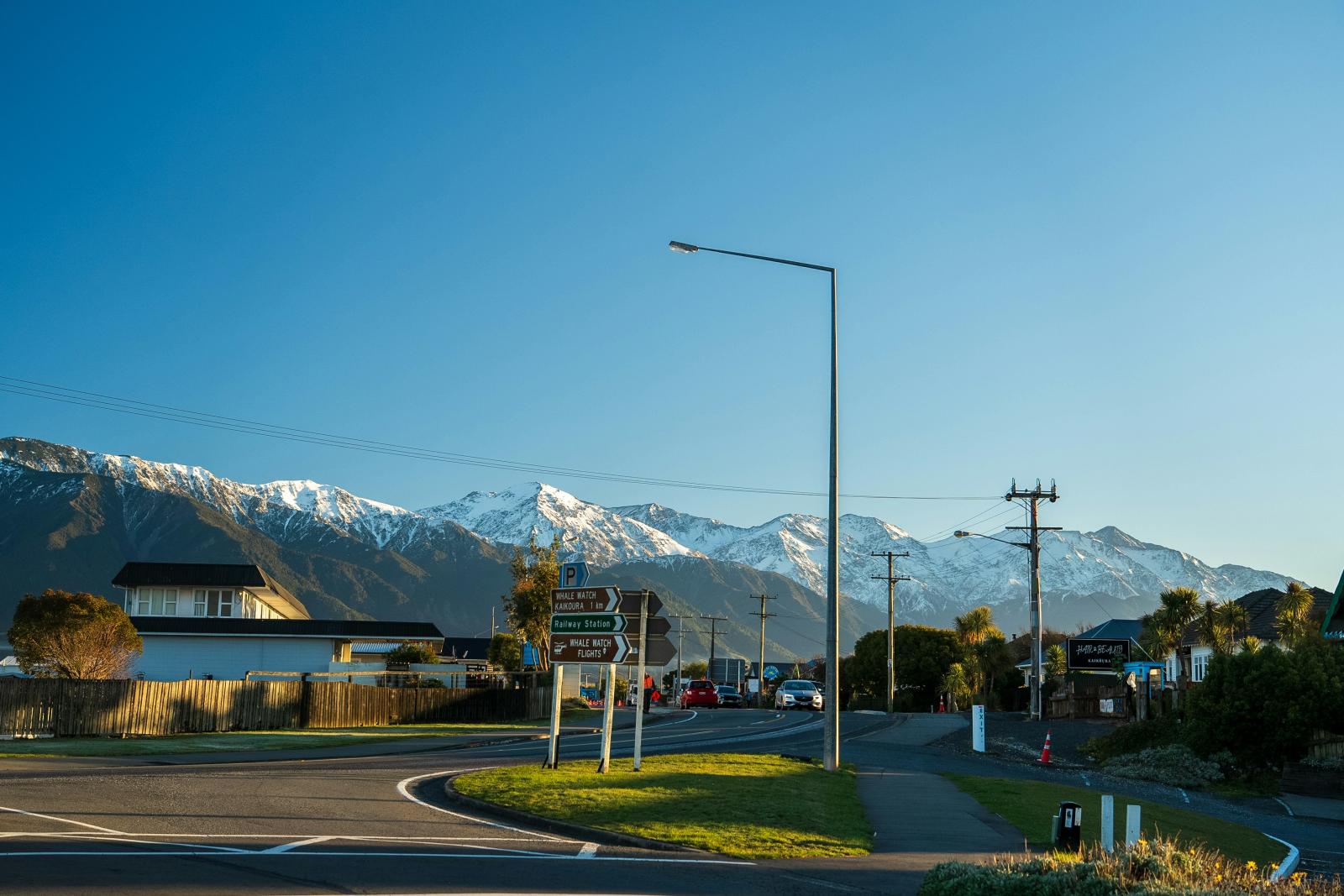 Kaikōura township with the snow-capped Seaward Kaikōura Range, on the coastal drive to Picton, South Island New Zealand