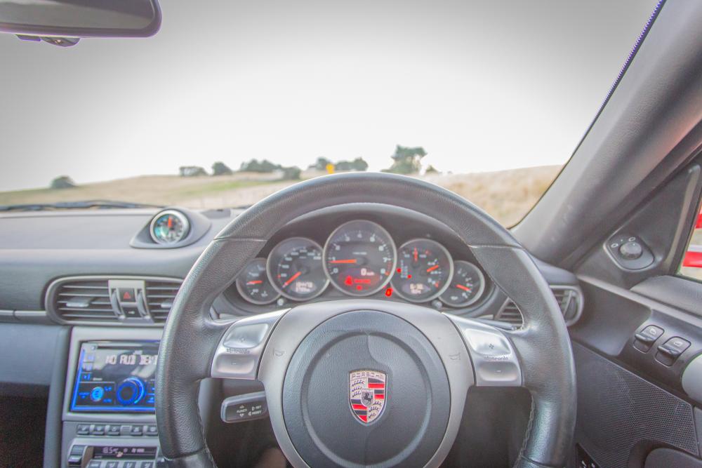 Porsche 911 Carrera interior — steering wheel and instrument cluster